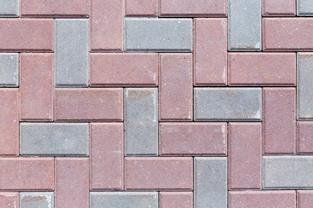 Brick pavement tile, top view. Urban texture as background.