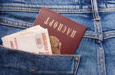 Russian rouble bills and passport in the back jeans pocket close upの写真素材