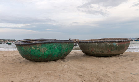 Picturesque seascape with coracles on Danang Beach Jul 2016の写真素材