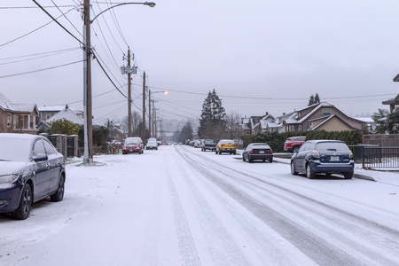 Wheel tracks on the road covered with snowの写真素材