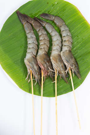 Raw pork sausage vegetable shrimp placed on dish prepare for grill.の写真素材