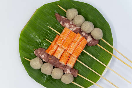 Raw pork sausage vegetable shrimp placed on dish prepare for grillの写真素材