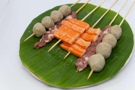 Raw pork sausage vegetable shrimp placed on dish prepare for grillの写真素材