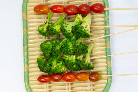 Raw pork sausage vegetable shrimp placed on dish prepare for grillの写真素材