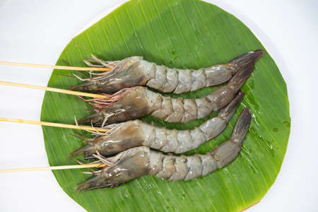 Raw pork sausage vegetable shrimp placed on dish prepare for grillの写真素材
