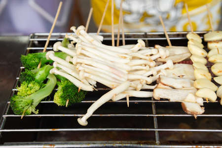 Raw pork sausage vegetable shrimp placed on dish prepare for grill.の写真素材