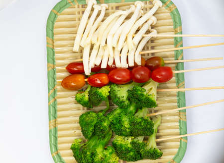 Raw pork sausage vegetable shrimp placed on dish prepare for grill.の写真素材