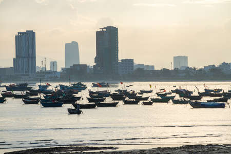 Basket boat and  Fishing boat with Lady Buddha on monkey mountain, Danang Vietnamのeditorial素材