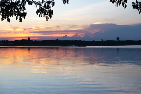 Wooden pier at sunset on a lake in Bueng Kan, Thailand 2022の写真素材