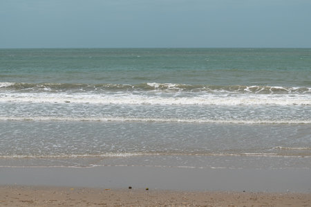 beach on the background of the sea and the sky with cloudsの写真素材