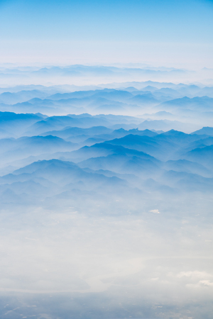 10,000 meters high altitude aerial view of the mountains and the sea of cloudsの写真素材
