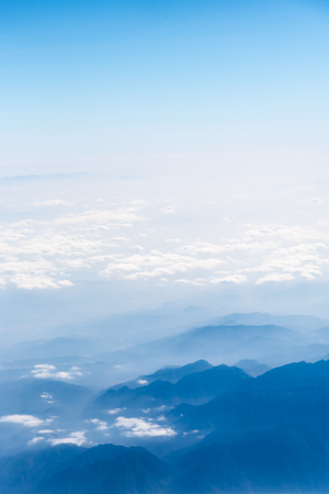 10,000 meters high altitude aerial view of the mountains and the sea of cloudsの写真素材