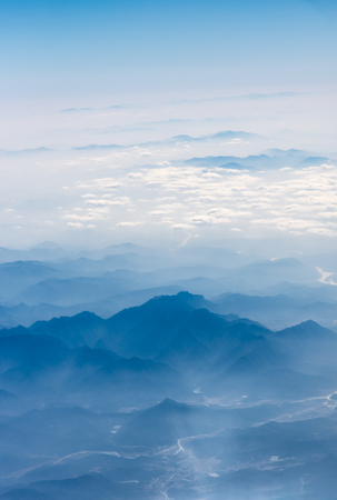 10,000 meters high altitude aerial view of the mountains and the sea of cloudsの写真素材