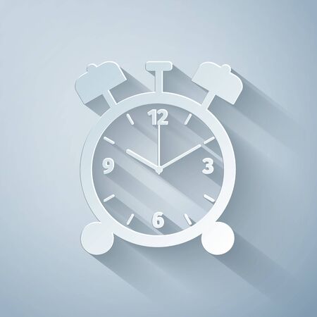 Paper cut Alarm clock icon isolated on grey background. Wake up, get up concept. Time sign. Paper art style. Vector Illustrationのイラスト素材