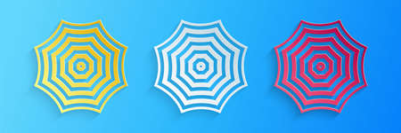 Paper cut Sun protective umbrella fo beach icon isolated on blue background. Large parasol for...
