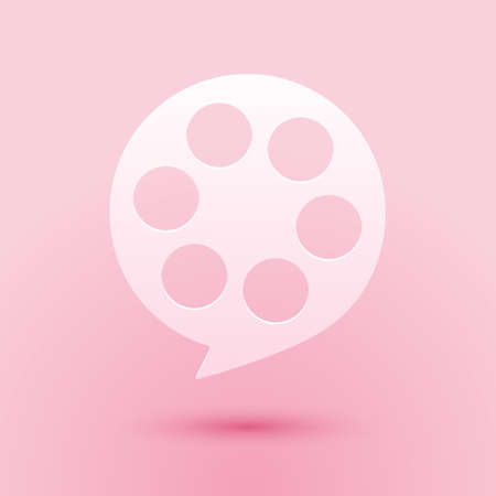 Paper cut Film reel icon isolated on pink background. Paper art style. Vectorのイラスト素材