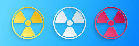 Paper cut Radioactive icon isolated on blue background. Radioactive toxic symbol. Radiation Hazard sign. Paper art style. Vectorのイラスト素材
