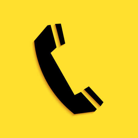 Black Telephone handset icon isolated on yellow background. Phone sign. Call support center symbol. Communication technology. Long shadow style. Vectorのイラスト素材