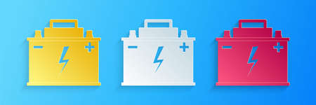 Paper cut Car battery icon isolated on blue background. Accumulator battery energy power and...
