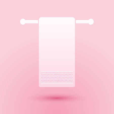 Paper cut Towel on a hanger icon isolated on pink background. Bathroom towel icon. Paper art style. Vectorのイラスト素材