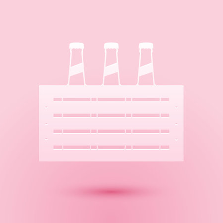 Paper cut Pack of beer bottles icon isolated on pink background. Wooden box and beer bottles. Case crate beer box sign. Paper art style. Vectorのイラスト素材