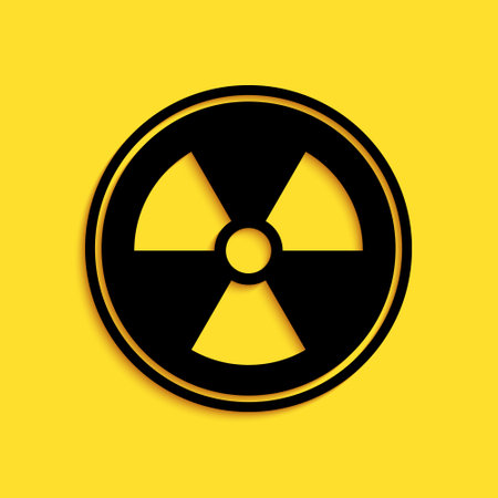 Black Radioactive icon isolated on yellow background. Radioactive toxic symbol. Radiation Hazard sign. Long shadow style. Vectorのイラスト素材