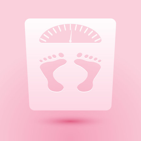 Paper cut Bathroom scales with footprints icon isolated on pink background. Weight measure Equipment. Weight Scale fitness sport concept. Paper art style. Vectorのイラスト素材