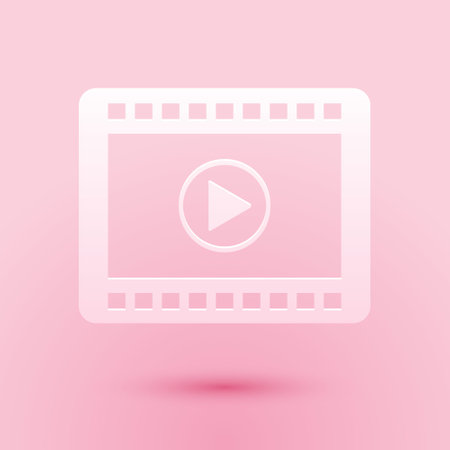 Paper cut Play Video icon isolated on pink background. Film strip with play sign. Paper art style. Vectorのイラスト素材