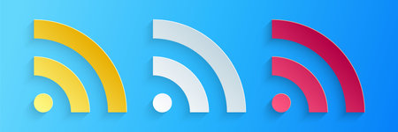Paper cut RSS icon isolated on blue background. Radio signal. RSS feed symbol. Paper art style....