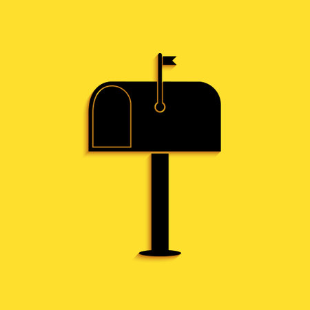 Black Mail box icon isolated on yellow background. Mailbox icon. Mail postbox on pole with flag. Long shadow style. Vectorのイラスト素材