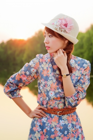Fashion model at sunrise in white dress の写真素材