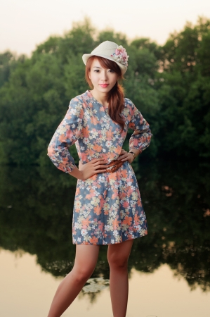 Fashion model at sunrise in white dress の写真素材