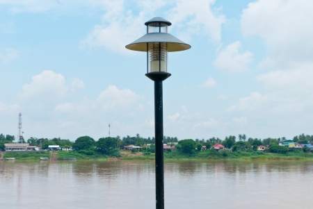 Black metal street-lights along the pier-head alongside the River at NongKhai Thailandの写真素材