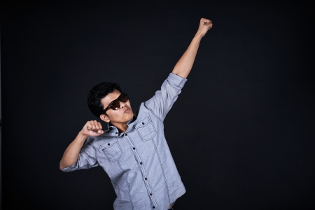 Young man presenting and showing your text or productの写真素材