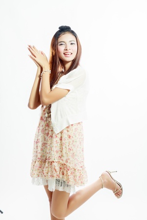 teen girl beautiful cheerful enjoying isolated on white background の写真素材