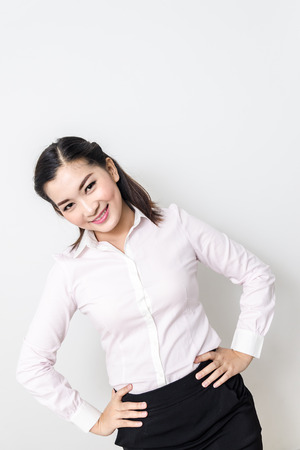 Portrait of smiling business woman, isolated on white backgroundの写真素材