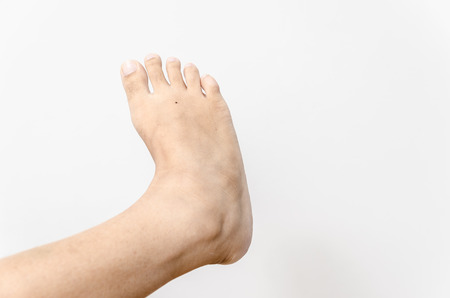 Beautiful female a foot and a heel on a white background の写真素材