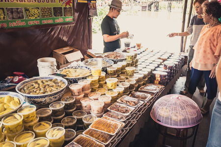 Phra Nakhon Si Ayutthaya, Thailand - April 14, 2015: Ayothaya Floating Market. Has a many visitors, both Thais and foreign visitors with varieties of Thai clothes and Thai food at Ayutthaya,Thailandのeditorial素材