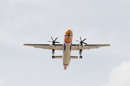 BANGKOK, THAILAND - MAY 20, 2015: HS-DQA Nok Air atr72-200 De Havilland Canada DHC-8-400 - cn 4455 landing to Don Mueang International Airport Thailand. Nok Air company is the largest low cost airlines in Thailand.のeditorial素材