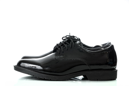 Black patent leather men shoes army  isolated on white backgroundの写真素材