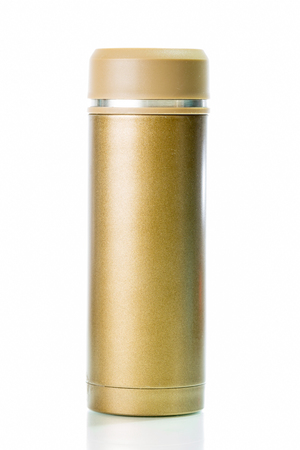 Gold metal thermos isolated on white backgroundの写真素材