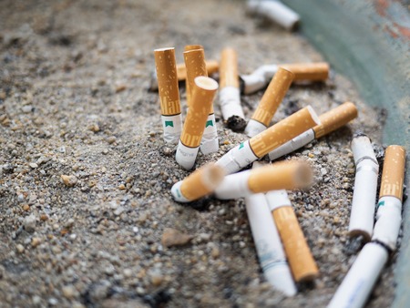 Bangkok, Thailand - May 25, 2018:The cigarette butts are left on a small sand tray. In the smoking...