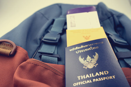 Thailand passport and vaccine passport on the baggage of tourists. Certificate of vaccination for travel during coronavirus outbreak.の写真素材