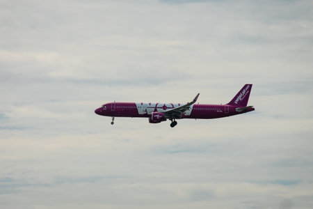 Bangkok, Thailand - August 26, 2023 : Vietjet Air WOW graphic prepare for Landing at Suvarnabhumi Airport, Thailand. Transportation travel via commercial air plane.のeditorial素材