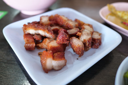 Crispy pork belly delight local eatery food photography casual dining close-up culinary experienceの写真素材