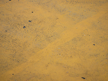 Exploring the textured surface of yellow sand natural landscape detailed photography outdoor environment close-up view nature's beautyの写真素材