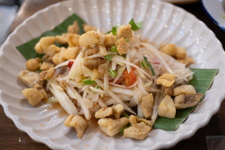 Cooking action thai papaya salad preparation local market food photography vibrant atmosphere...