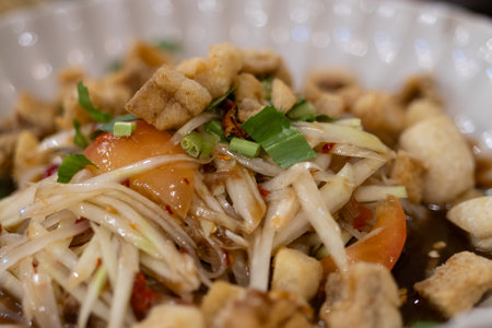 Tasty papaya salad preparation local market food photography vibrant kitchen close-up culinary...