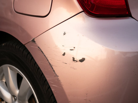 Car scratch repair urban parking lot photo daylight close-up vehicle maintenance tipsの写真素材