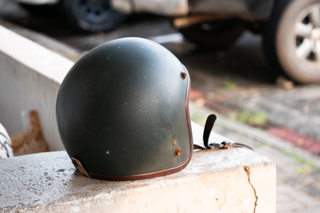 Motorcycle helmet on urban street safety gear outdoor environment close-up perspective urban lifestyle insightsの写真素材